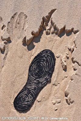 lost boot on sand at the beach